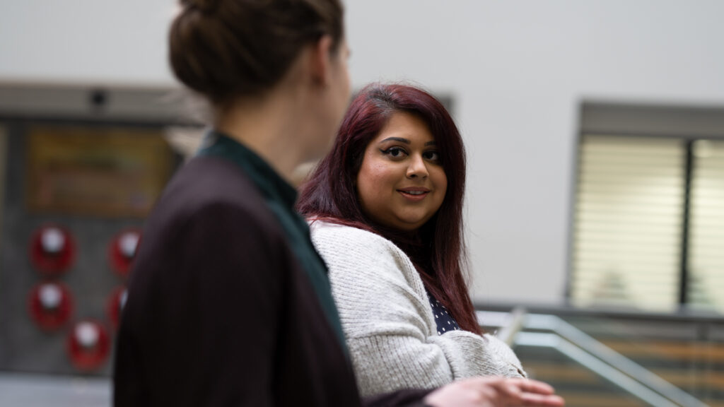 Two female members of Home Office staff talking