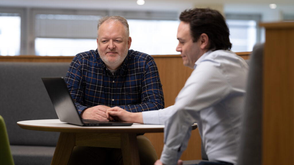 Two Home Office staff in an informal meeting